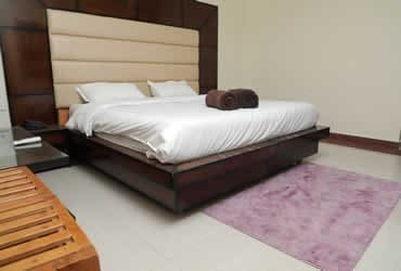 Clean And Comfortable Deluxe Triple Bed Non AC Room at Hotel Sakshi Uttarkashi, offering a comfortable stay for those searching for a hotel in Uttarkashi.
