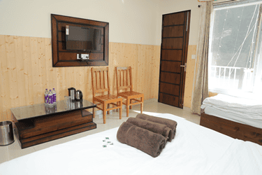 Cozy Deluxe Double Non AC Room at Hotel Sakshi Uttarkashi, perfect for travelers looking for budget hotels in Uttarkashi