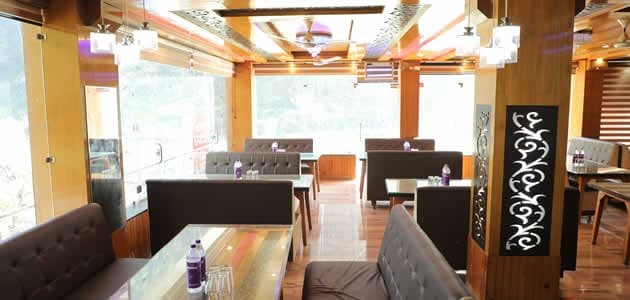Elegantly lit restaurant interior at Hotel Sakshi Uttarkashi, perfect for enjoying local meals during your stay