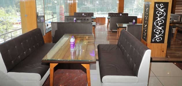 Clean and well-maintained dining tables at the in-house restaurant of Hotel Sakshi, providing the best local food experience in Uttarkashi